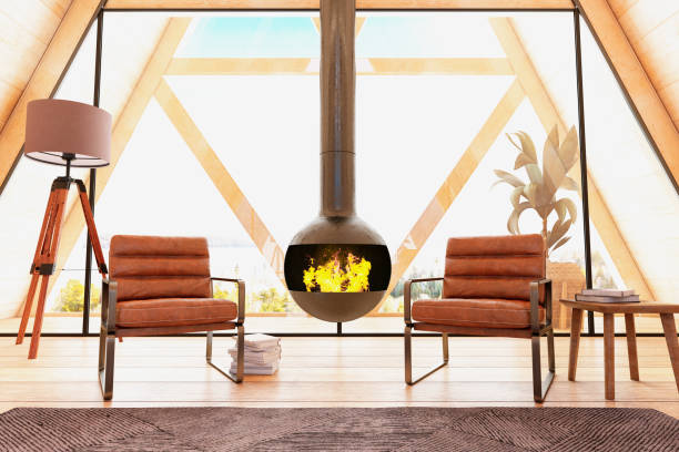 istock Two Leather Armchairs with Fire Place in Wooden Triangle Tiny House 1239929316