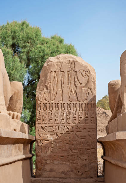 istock Hieroglyphic carvings on an ancient egyptian temple stone tablet 1239938568