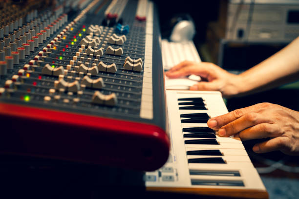 istock music composer hands playing on piano keys in recording studio 1239938586