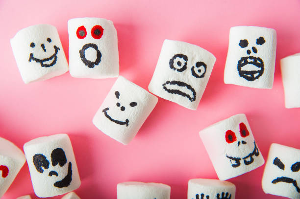 istock Marshmallows close-up and copy space on a pink background. Marshmallows for Halloween emoticons. 1239941844