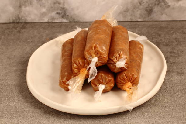 istock traditional raw pork sausage in plastic 1239944561