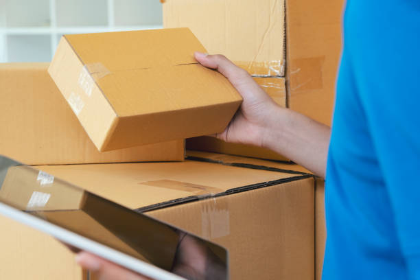 istock The shipping company checking parcels list before delivering to customers 1239946169