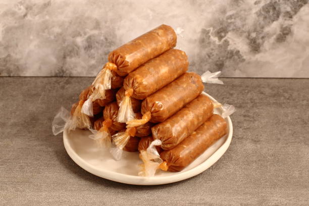 istock traditional raw pork sausage in plastic 1239958535