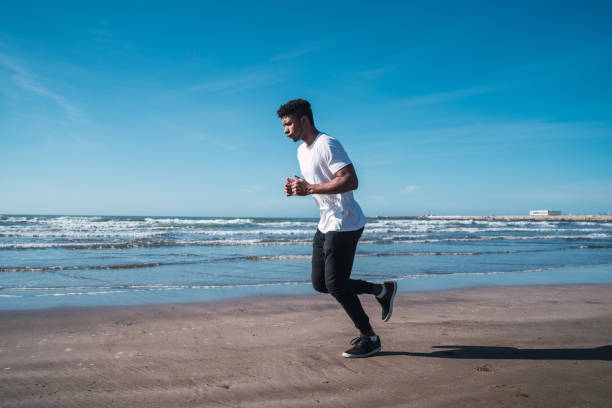 istock Portrait of an athletic man running. 1239966169