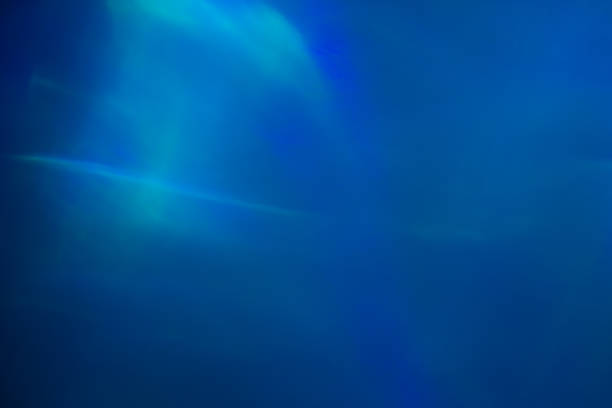 istock Blurred lens flare. Defocused colorful lights. Shiny glowing spots, abstract background and texture 1239979279