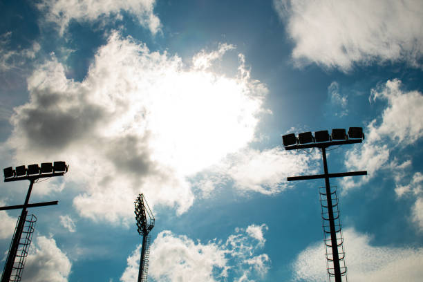 istock spot light lamp pole against sun and sky on the summer day time 1239980370