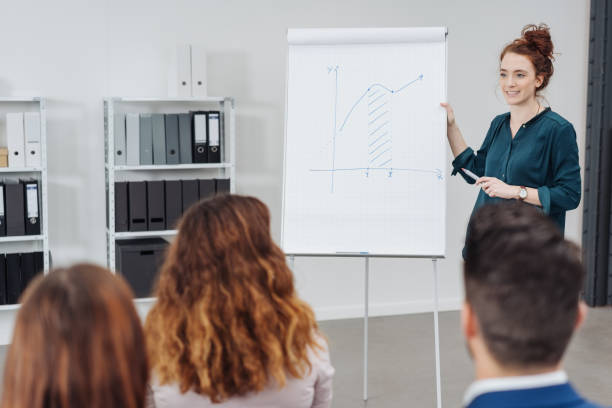 istock Young businesswoman giving a presentation 1240016716