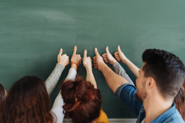 istock Group of university student giving a thumbs up 1240018934
