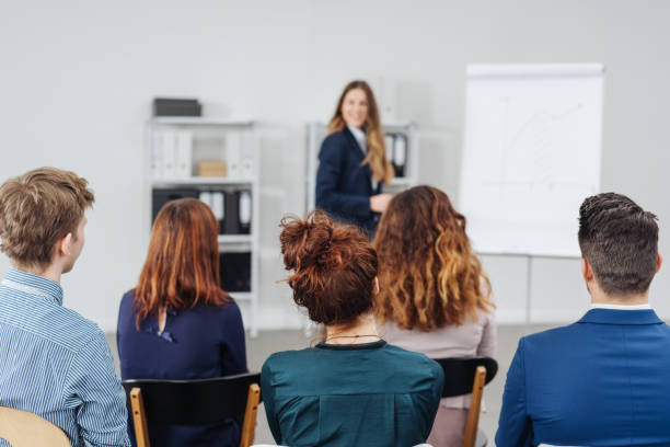 istock Group of young professional people in a meeting 1240022251