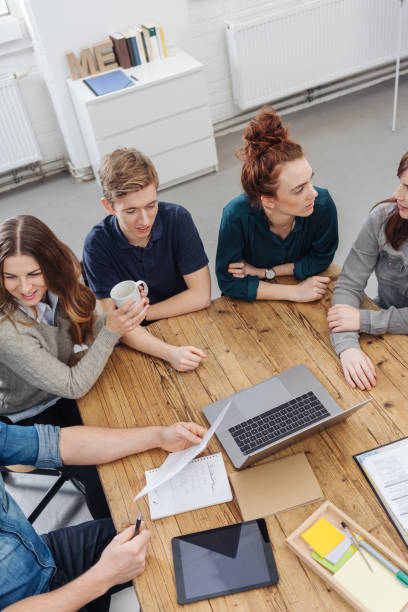 istock Young business team in a brainstorming session 1240025003