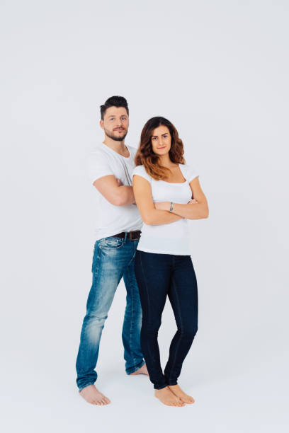 istock Confident casual barefoot young couple in jeans 1240028907