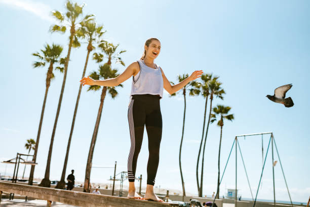 istock Hispanic Woman Athlete Strength Training At Venice Beach 1240034876