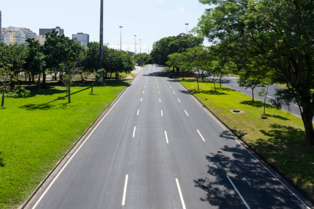 istock Beautiful view to empty highway street on green area 1240048075