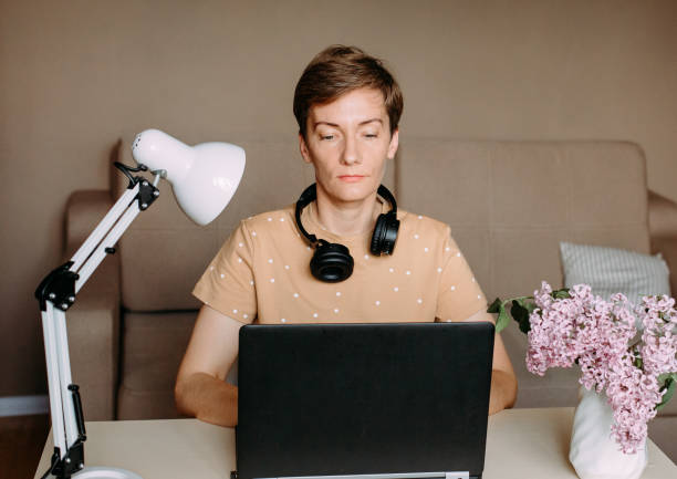 istock woman in bright home office working laptop 1240049730