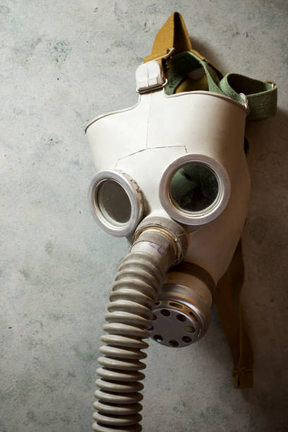 istock Old respiratory mask from the Cold War era, hanging in a wall. 1240049747
