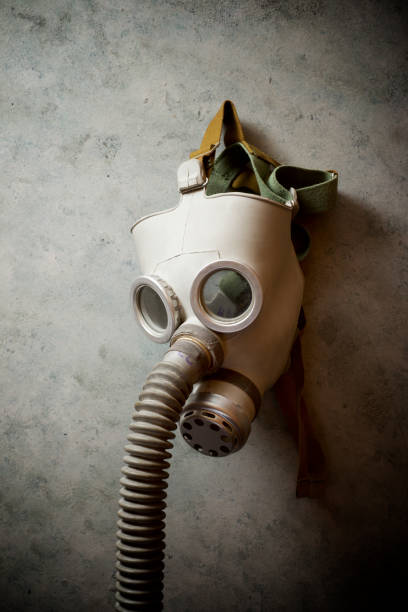 istock Old respiratory mask from the Cold War era, hanging in a wall. 1240049754