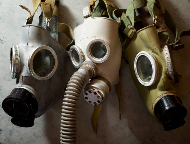 istock Old respiratory masks from the Cold War era, hanging in a wall. 1240049760
