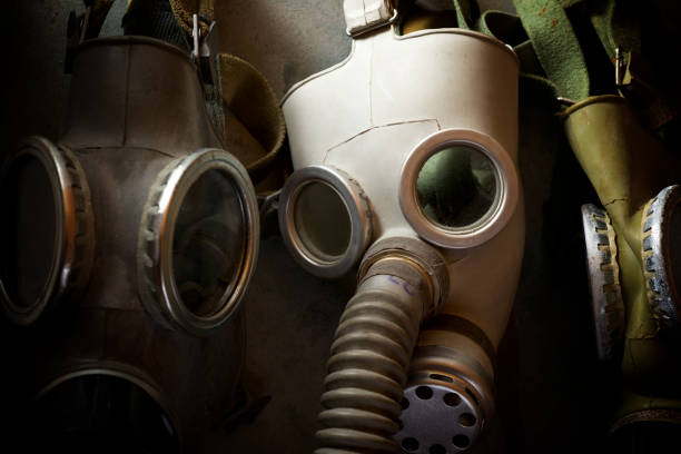 istock Old respiratory masks from the Cold War era, hanging in a wall. 1240049769