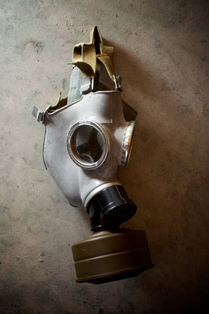 istock Old respiratory mask from the Cold War era, hanging in a wall. 1240050299