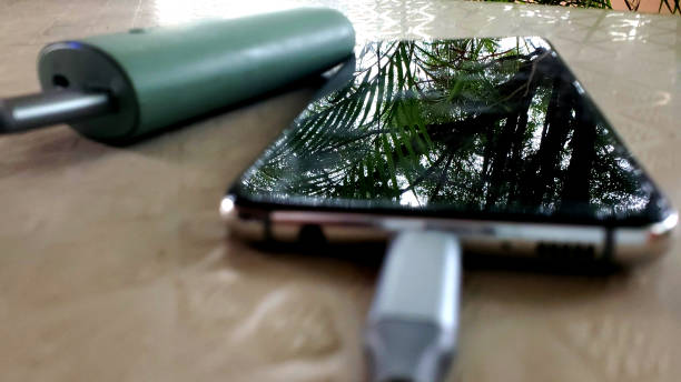 istock Blurred phone charging outside with power bank 1240061197