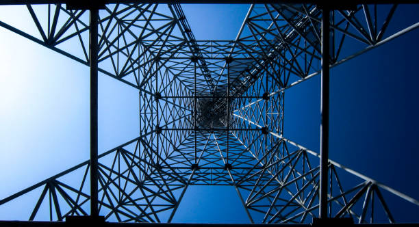 istock High technology blue background. Electric tower, bottom view. Square, geometric shapes. 1240066567