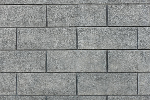 istock Grey brick wall background of dark texture for design. 1240104714