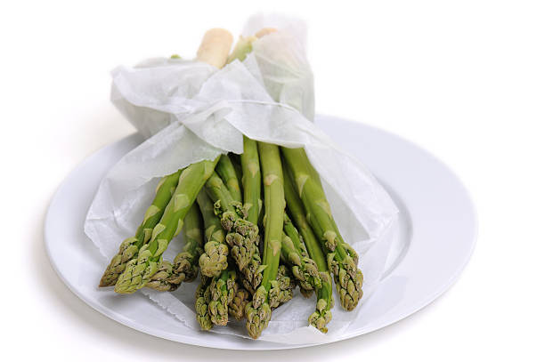 German Food Fresh Green Asparagus wrapped in White Paper
