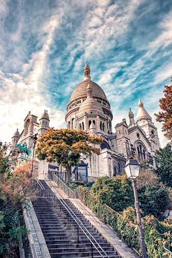 Church on the Montmartre hill in Paris, under a dramatic sky.