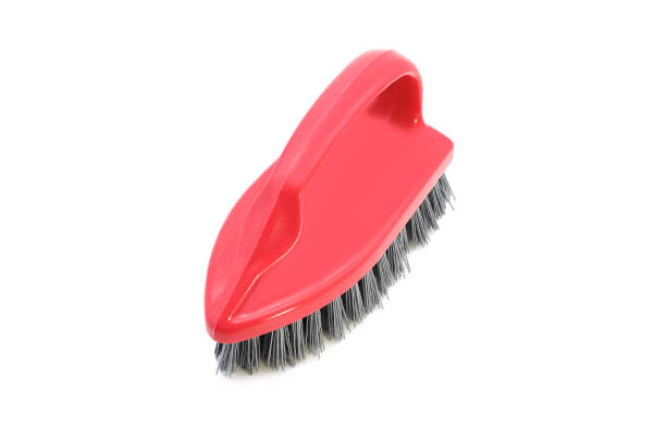 istock Red kitchen plastic brush in the shape of an iron isolated on a white background 1240135247