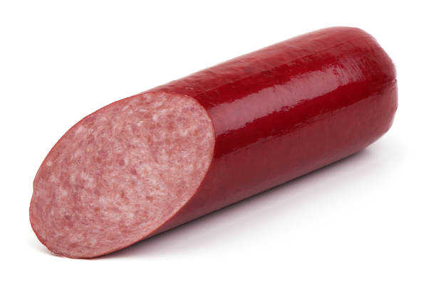 istock Sliced Salami smoked sausage, isolated on white background 1240137954
