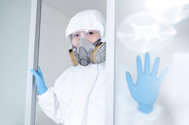 istock Medical worker wearing biohazard protective suit 1240159316