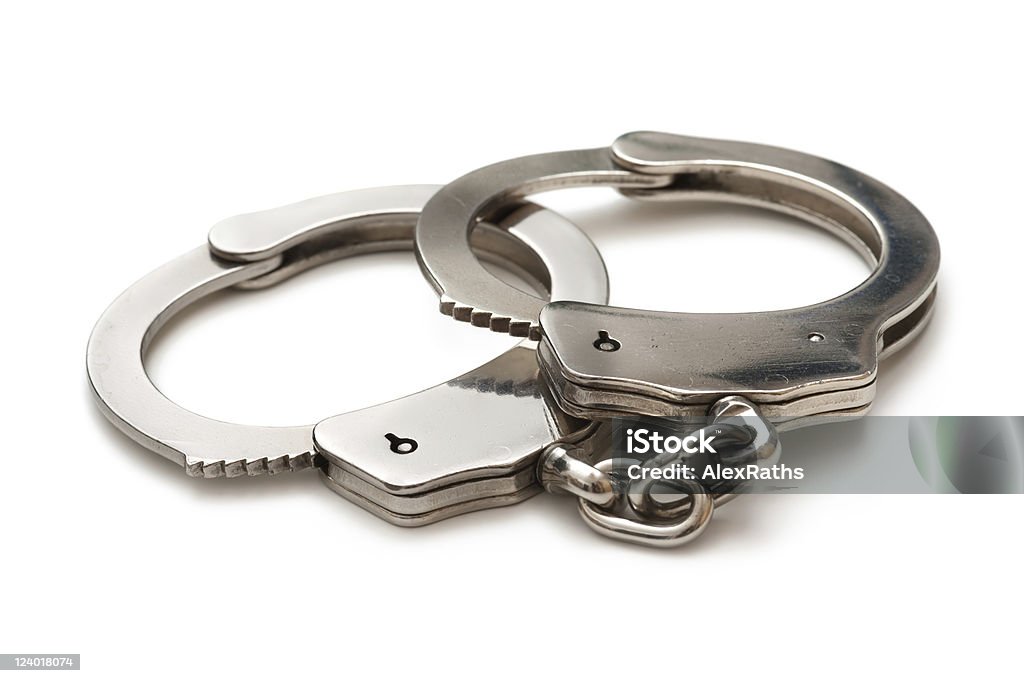 handcuffs handcuffs over white background Handcuffs Stock Photo