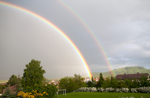 Rainbows over rural landscape