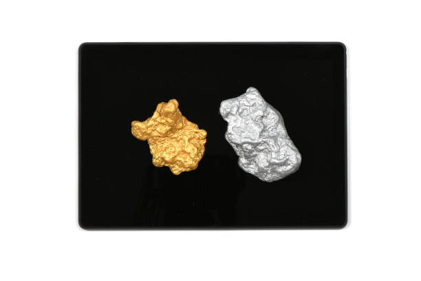 Tablet pc Silver and golden nugget on tablet pc isolated on white background. High resolution photo. Full depth of field. goldco precious metals complaints stock pictures, royalty-free photos & images