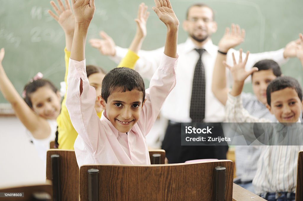 Education activities in classroom at school, children with teacher Education activities in classroom at school, happy children learning Child Stock Photo