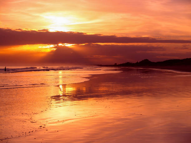 istock Morning light along Papamoa Beach 1240185940
