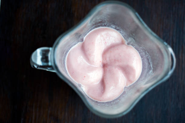 istock Banana Strawberry Smoothie in Blender 1240211425