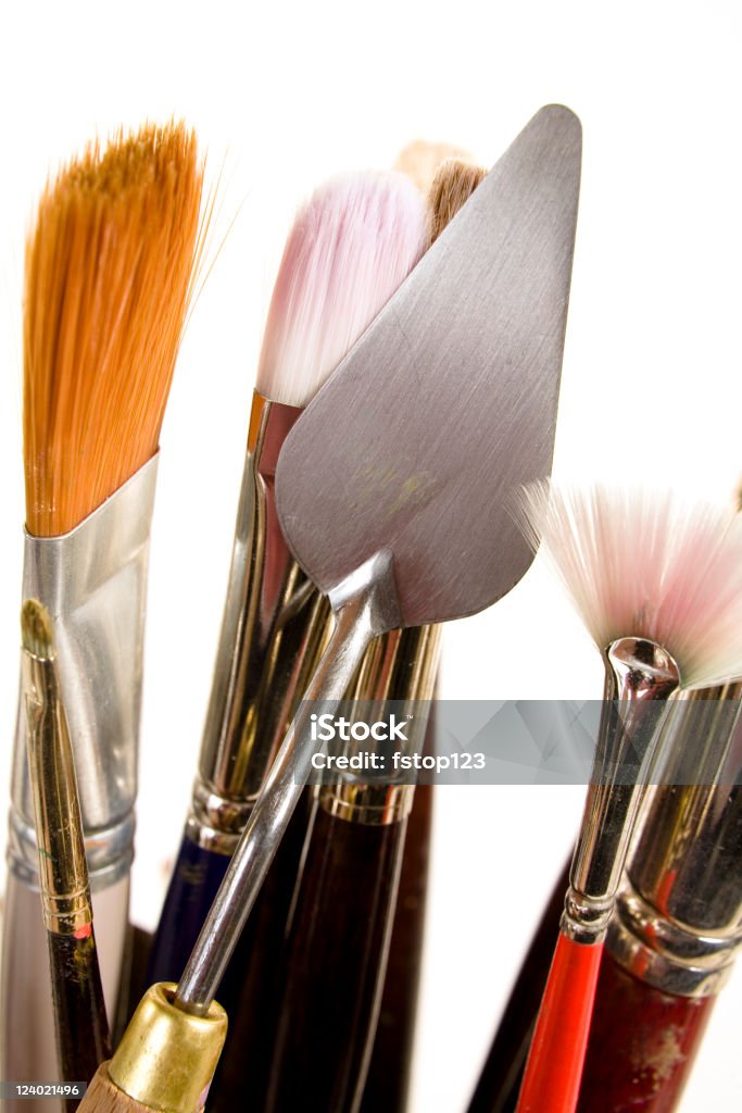 Pallet Knife and brushes for artist Artist pallet knife among brushes.  Copy area on pallet knife that is in sharp focus.  Art Stock Photo