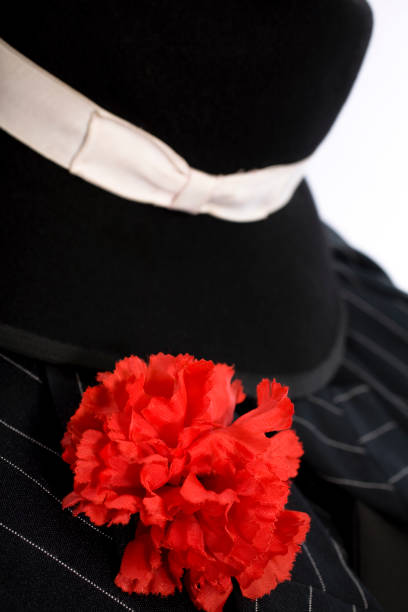 istock 1920's style suit red carnation in lapel and stylish hat. 124022298