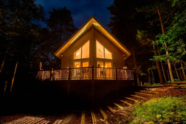 istock Vacation Home in Woods at Night 1240224386