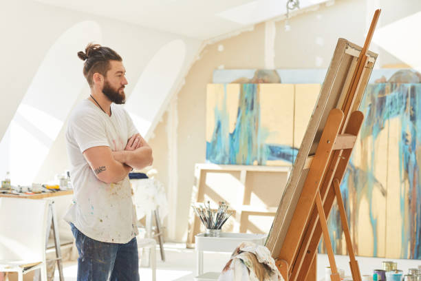 istock Contemporary Male Artist in Studio 1240227608