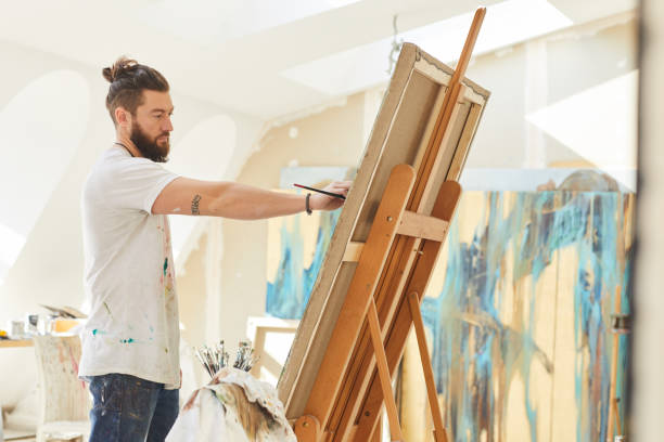 istock Male Artist Painting in Studio 1240227614