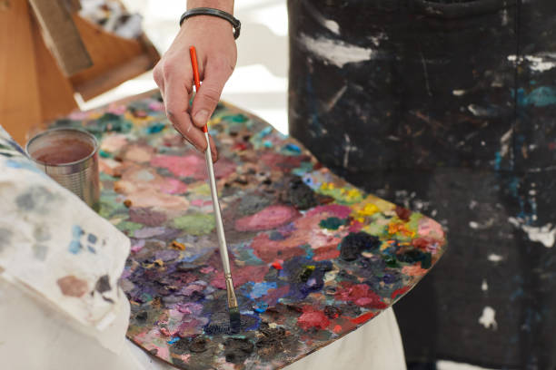 istock Unrecognizable Man Mixing Paint on Palette 1240227673