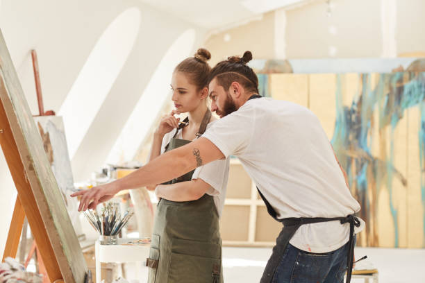 istock Young Couple Painting in Art Studio 1240227681