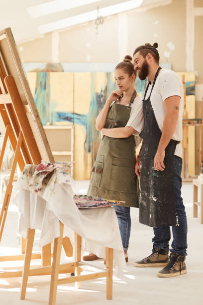 istock Couple Painting Picture in Art Studio 1240227692