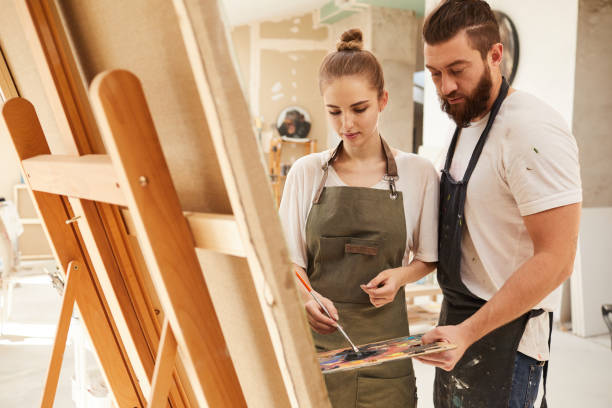 istock Creative Couple Painting Picture Together 1240227697