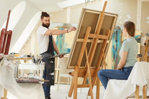 istock Beraded Artist Painting Portrait in Studio 1240227730
