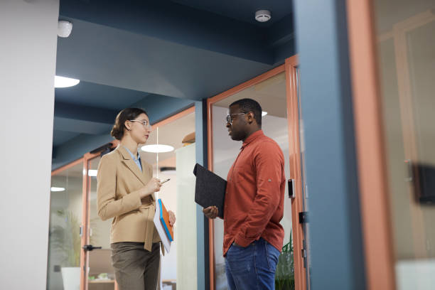 istock Contemporary Business People Chatting in Office 1240233109