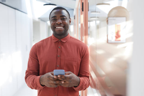 istock Young African Businessman Smiling at Camera 1240233148