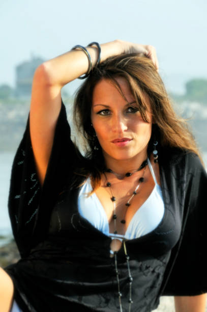 istock Stunning Woman on Beach Holiday - Bokeh 124023499